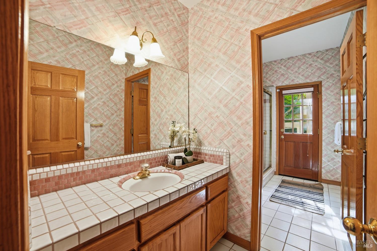 4818 Kieran Court Santa Rosa, CA 95405 - Photo 40 of 51 a bathroom with a sink and a mirror