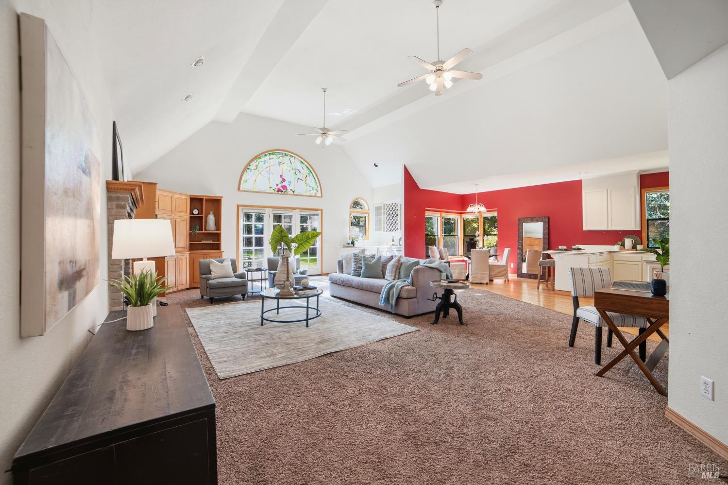 4818 Kieran Court Santa Rosa, CA 95405 - Photo 8 of 51 a living room with furniture a fireplace and a chandelier