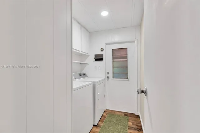 a view of hallway with washer and dryer