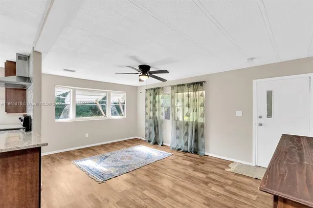 a view of livingroom with furniture wooden floor and window