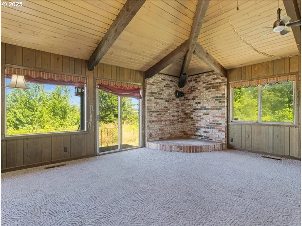 a view of livingroom with furniture and floor to ceiling window