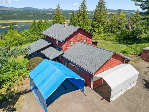 a backyard of a house with shaded area