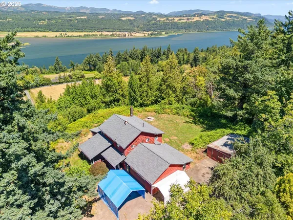an aerial view of a house with lake view