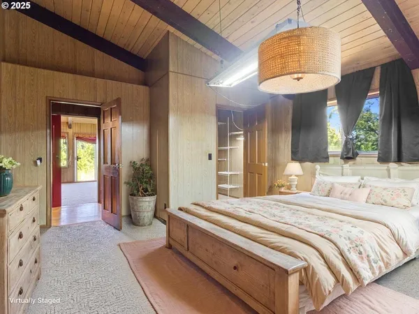 a kitchen with stainless steel appliances granite countertop a kitchen island hardwood floor sink stove dining table and chairs