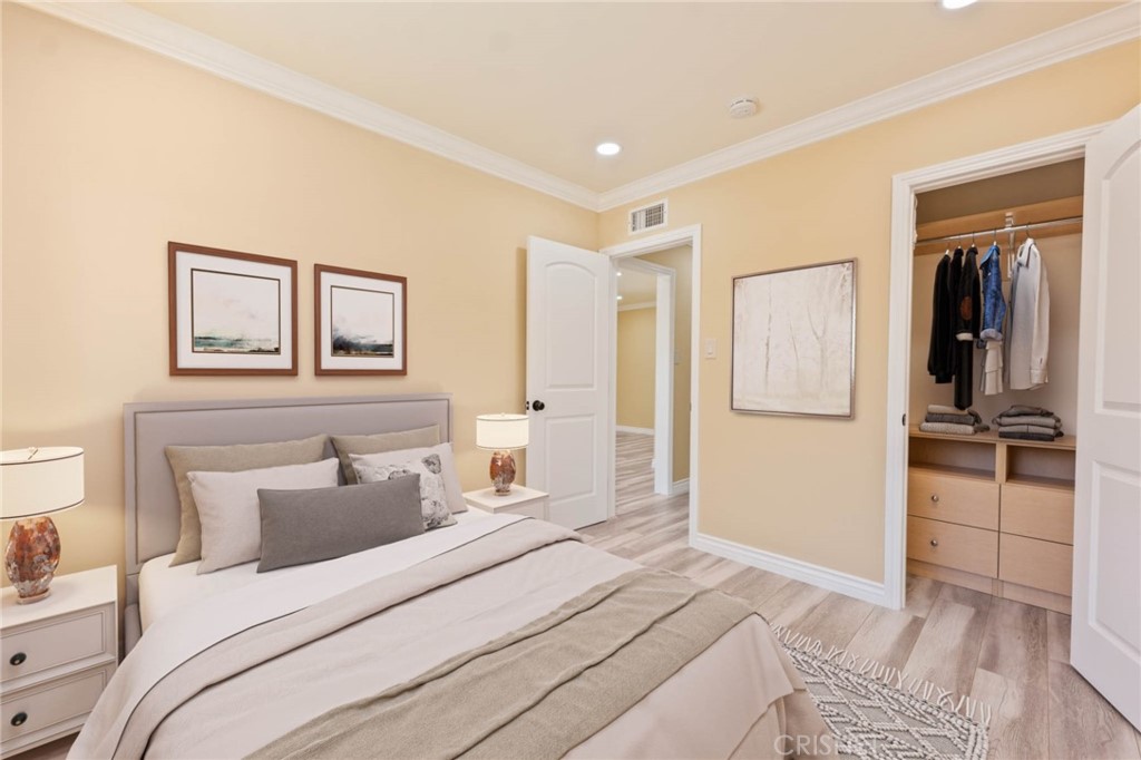 17604 Willard Street Northridge, CA 91325 - Photo 12 of 28 a bedroom with a bed and a large mirror