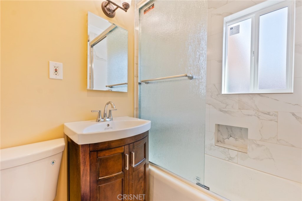 17604 Willard Street Northridge, CA 91325 - Photo 15 of 28 a bathroom with a sink a vanity and a mirror