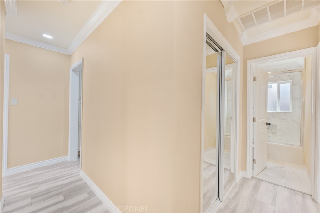 17604 Willard Street Northridge, CA 91325 - Photo 16 of 28 a view of a hallway with wooden floor