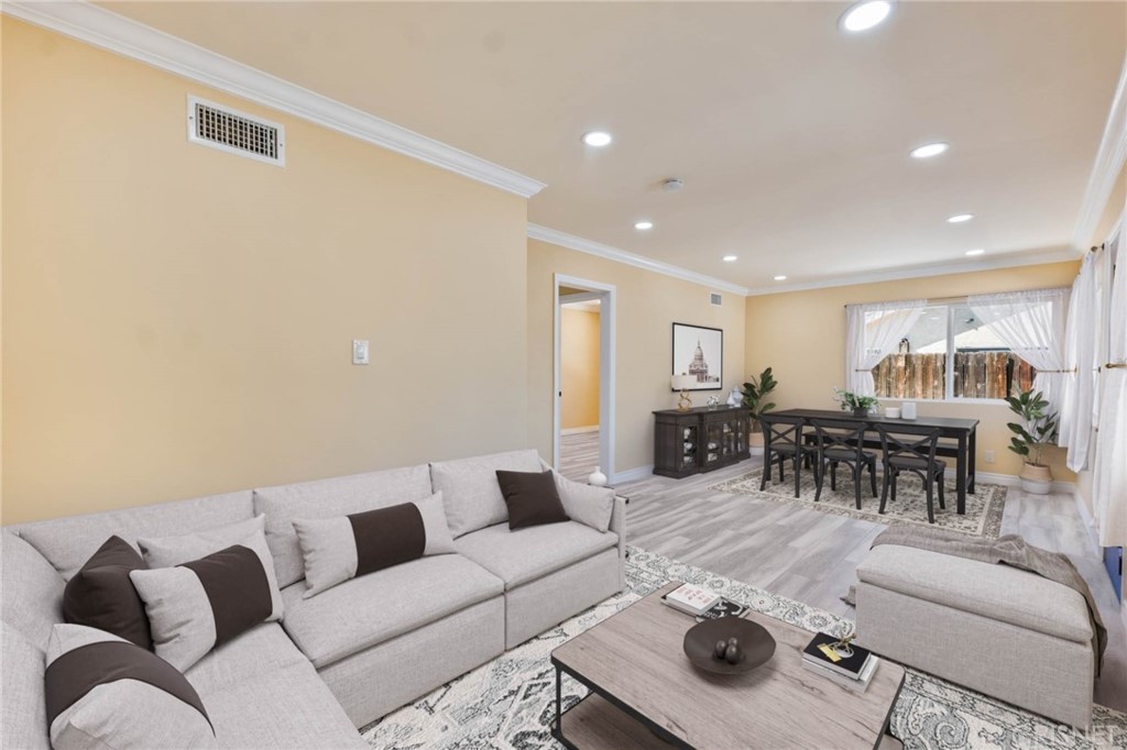 17604 Willard Street Northridge, CA 91325 - Photo 2 of 28 a living room with furniture and view of kitchen