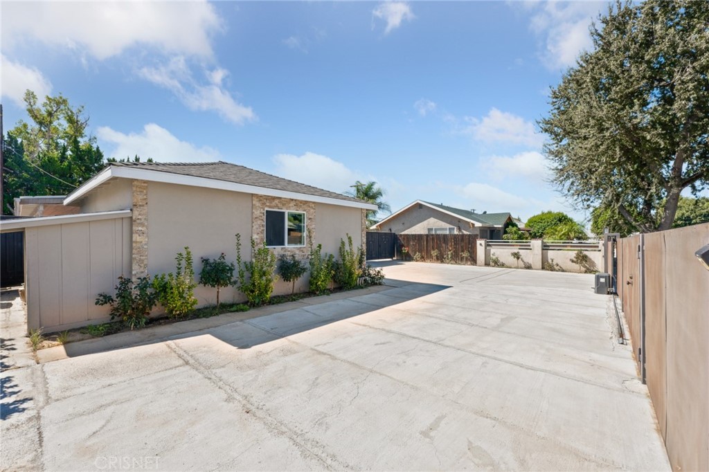 17604 Willard Street Northridge, CA 91325 - Photo 23 of 28 a front view of a house with garden