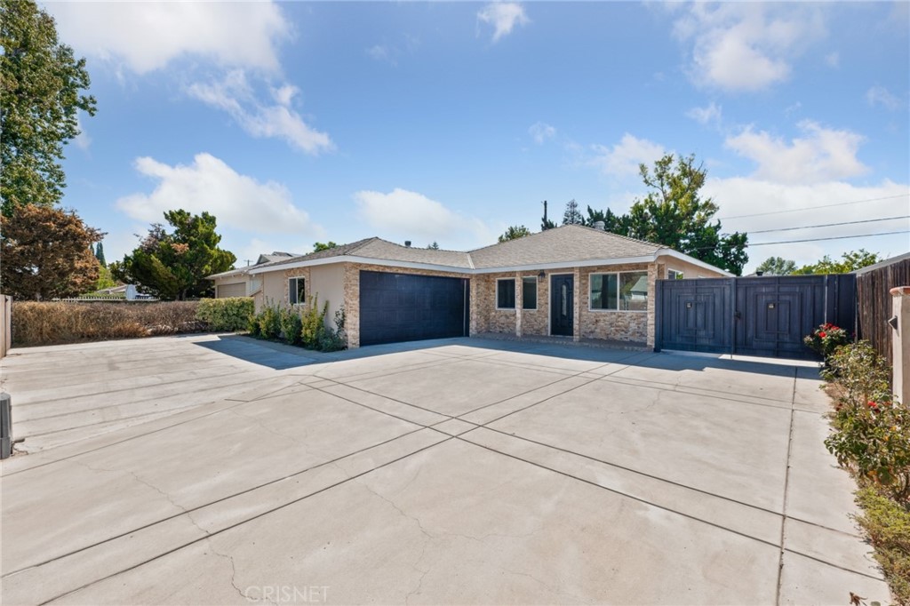 17604 Willard Street Northridge, CA 91325 - Photo 26 of 28 a front view of house with yard and trees around