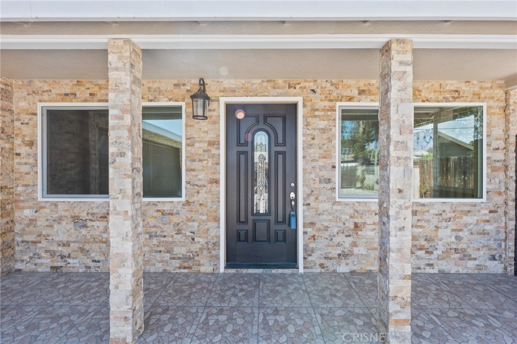 17604 Willard Street Northridge, CA 91325 - Photo 27 of 28 a front view of a house with a glass door