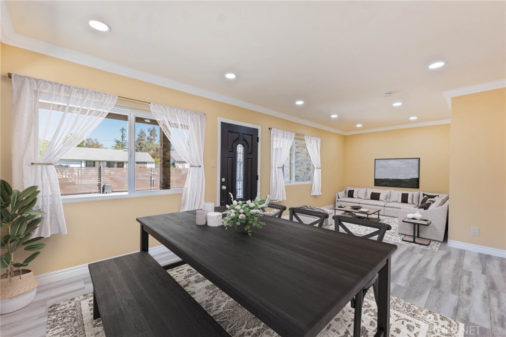 17604 Willard Street Northridge, CA 91325 - Photo 6 of 28 a living room with furniture a large window and wooden floor