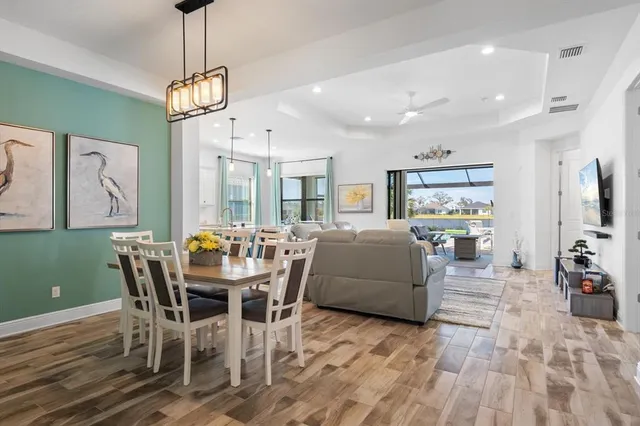 a view of a dining room with furniture window and wooden floor