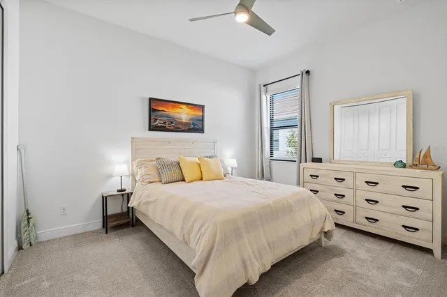 a view of a backyard with a garden and deck