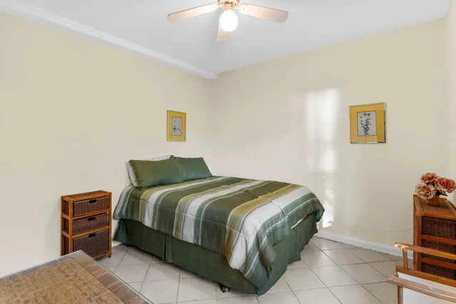 a view of a street with a palm trees