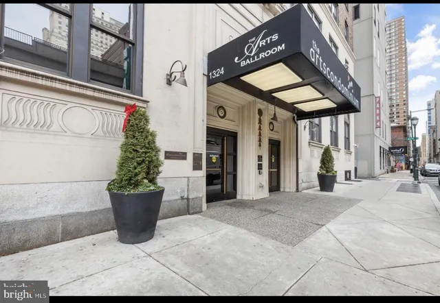 a view of a building with a potted plant