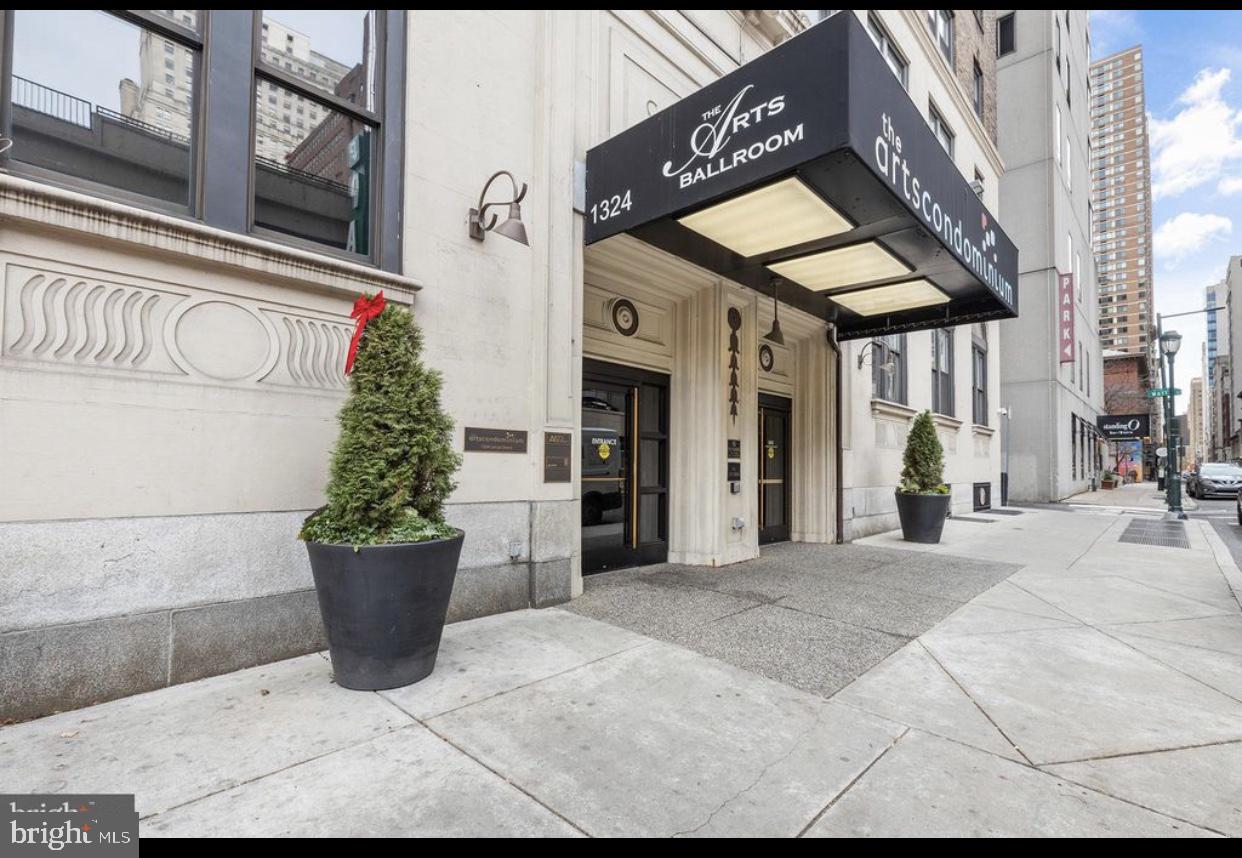 a view of a building with a potted plant