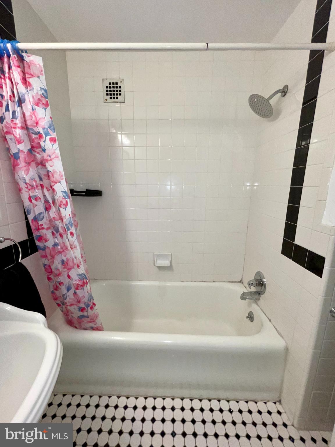 1324 Locust Street, Unit 308 Philadelphia, PA 19107 - Photo 11 of 11 a bathroom with a bathtub and shower