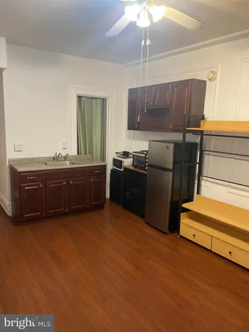 a kitchen with stainless steel appliances granite countertop a sink and cabinets