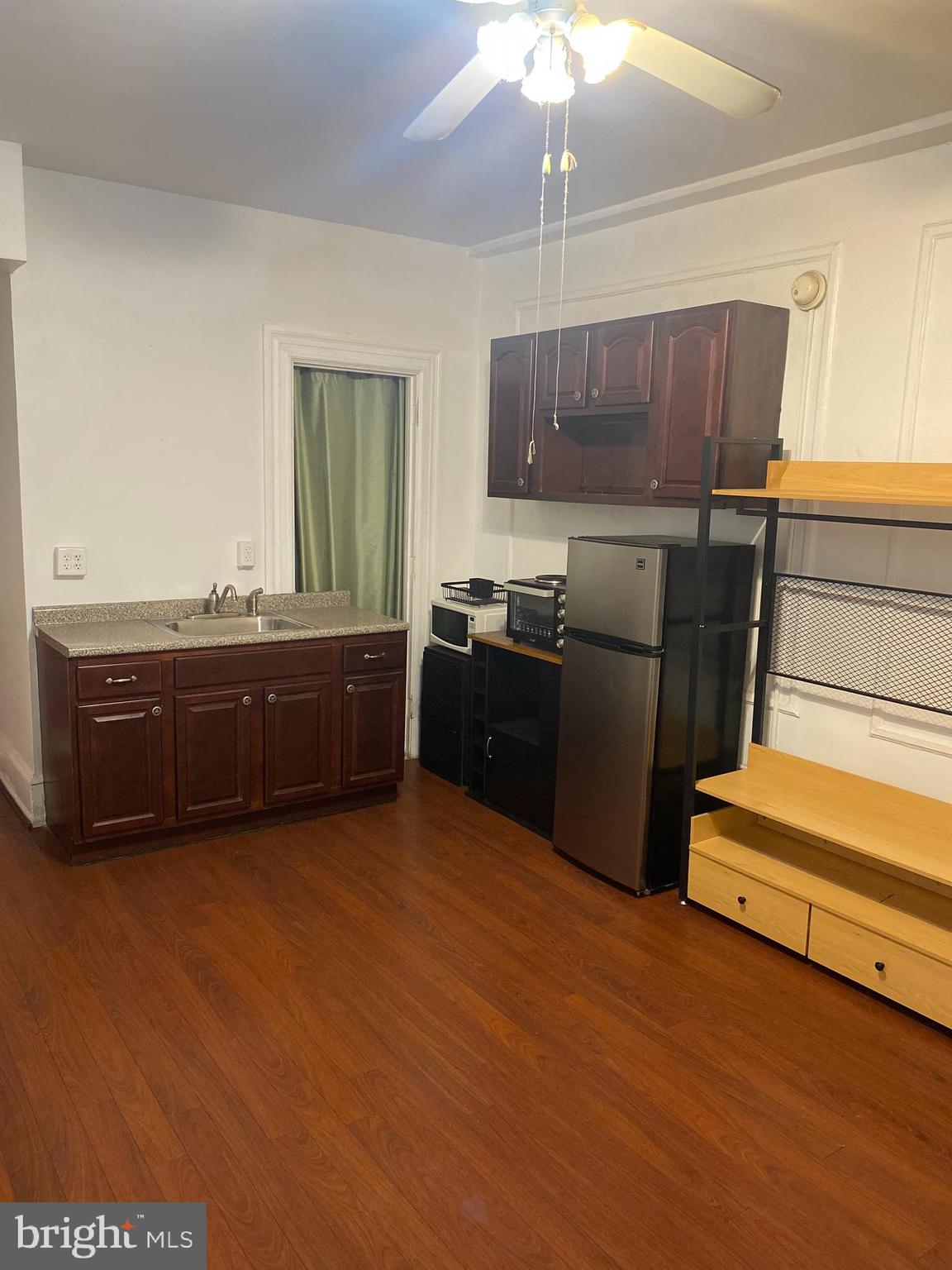 1324 Locust Street, Unit 308 Philadelphia, PA 19107 - Photo 4 of 11 a kitchen with stainless steel appliances granite countertop a sink and cabinets