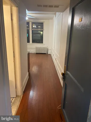 a view of gallery with wooden floor