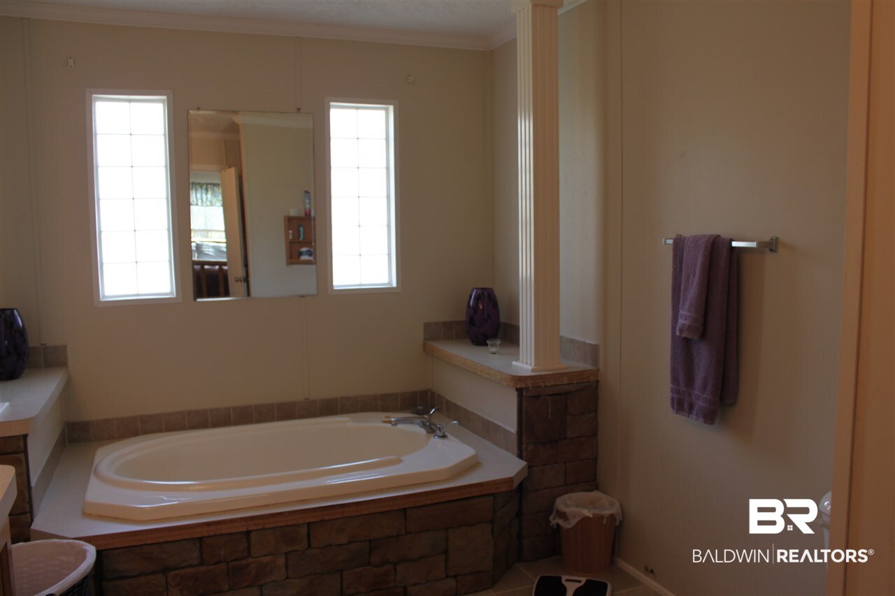 9380 Spice Pond Road Eight Mile, AL 36613 - Photo 30 of 36 Soaking tub with stone surround.