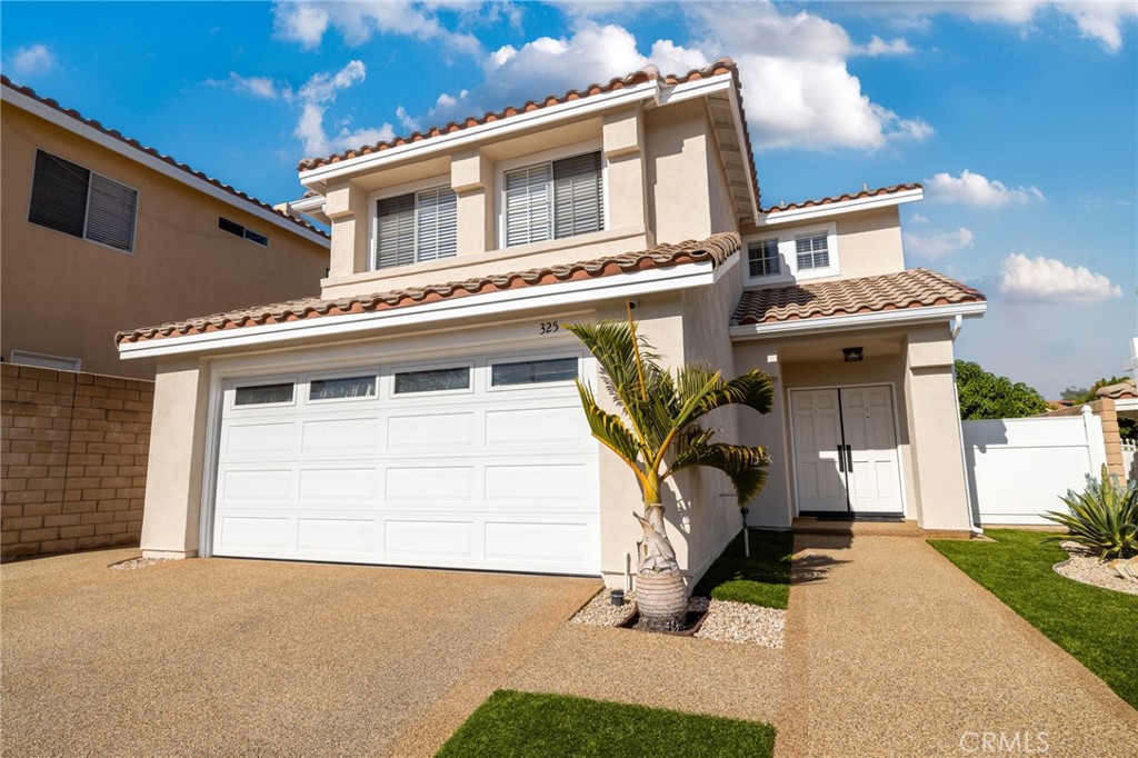 a view of a house with a garage
