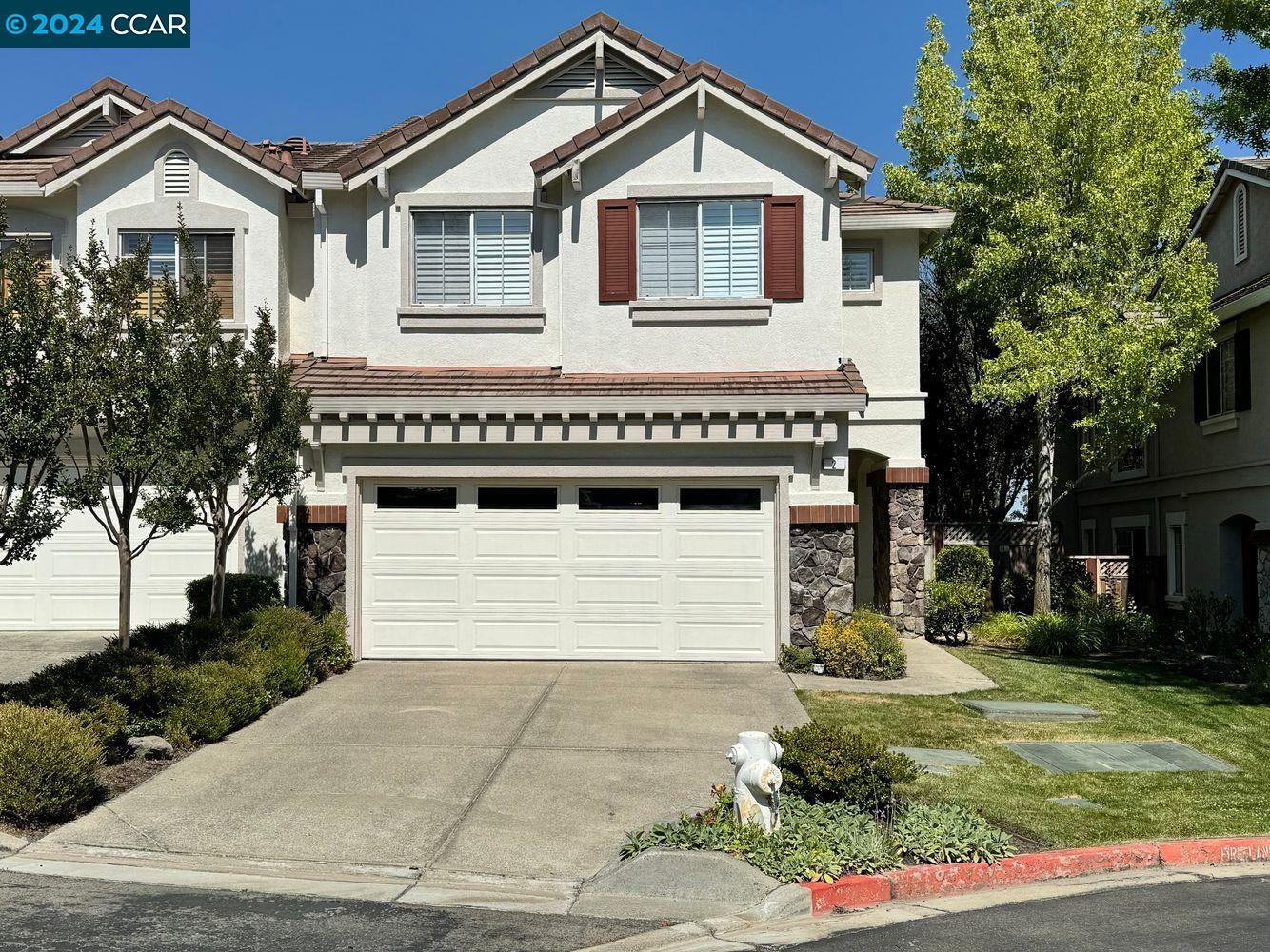 2 Foxglove Lane San Ramon, CA 94583 - Photo 1 of 1 a front view of a house with a yard and garage