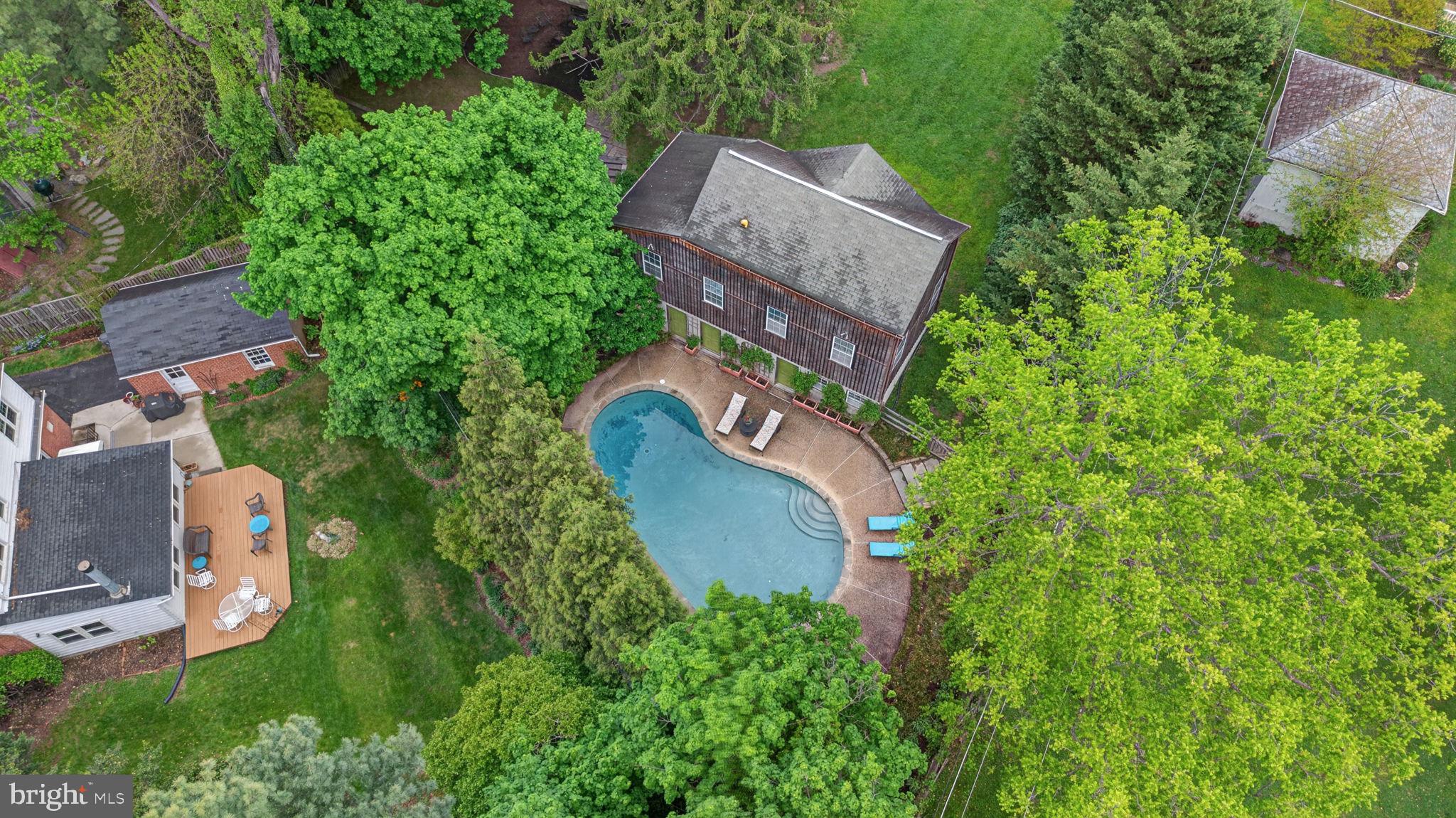 605 West Joppa Road Towson, MD 21204 - Photo 6 of 98 Lush oasis with a serene pool retreat.