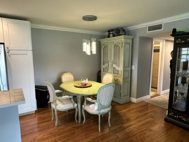 a view of a dining room with furniture and a table