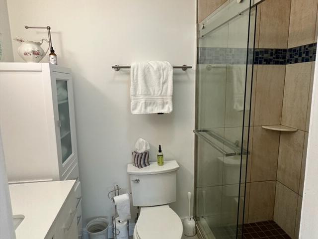 4585 Northwest 3rd Street, Unit D Delray Beach, FL 33445 - Photo 25 of 42 a bathroom with a toilet and a shower