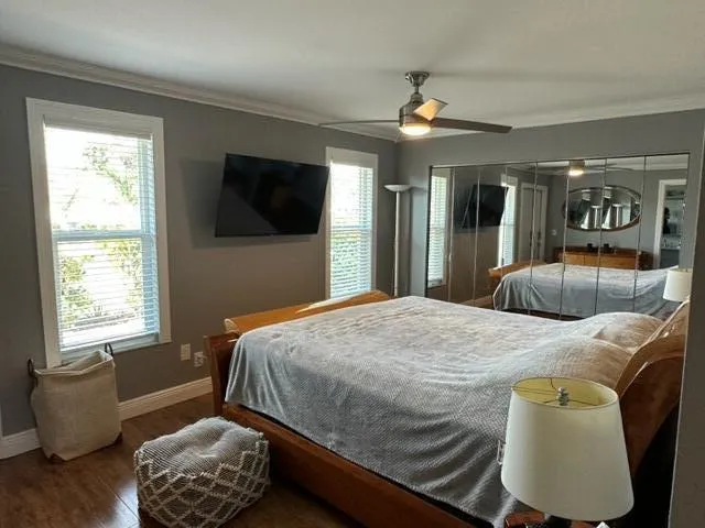 a bedroom with a bed window and couch