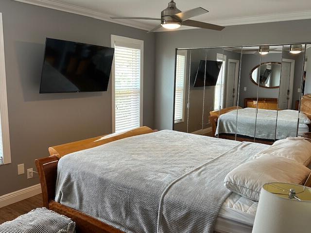 4585 Northwest 3rd Street, Unit D Delray Beach, FL 33445 - Photo 29 of 42 a bedroom with a bed and flat screen tv