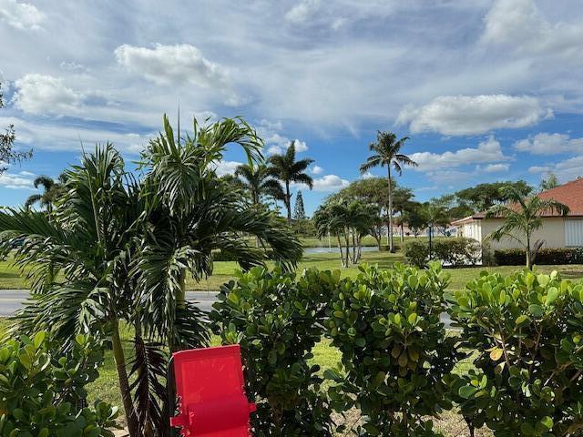 4585 Northwest 3rd Street, Unit D Delray Beach, FL 33445 - Photo 40 of 42 a backyard of a house with lots of green space