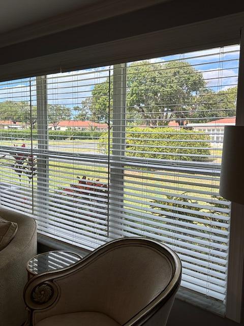 4585 Northwest 3rd Street, Unit D Delray Beach, FL 33445 - Photo 7 of 42 a side view of a room that has a car parked in it