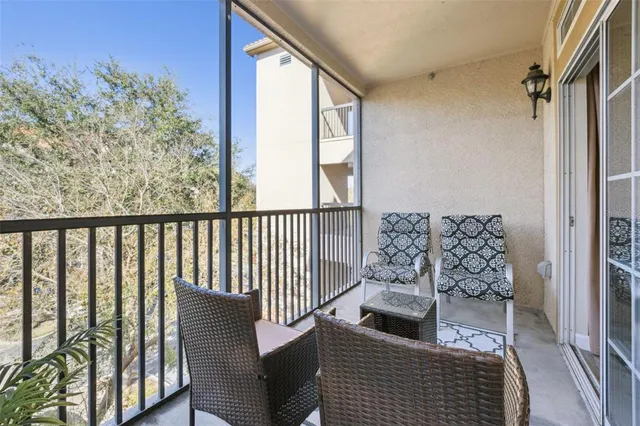 an aerial view of a house with a garden and lake view