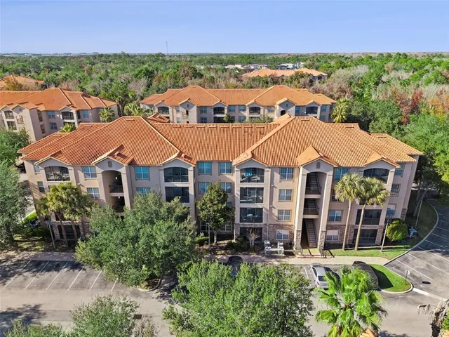 an aerial view of houses with outdoor space