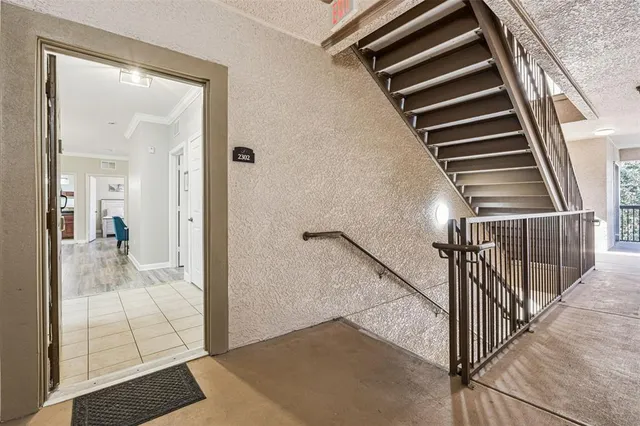 a view of a hallway view with staircase