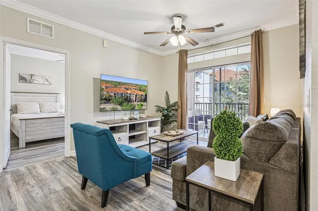 a dining room with furniture and chandelier