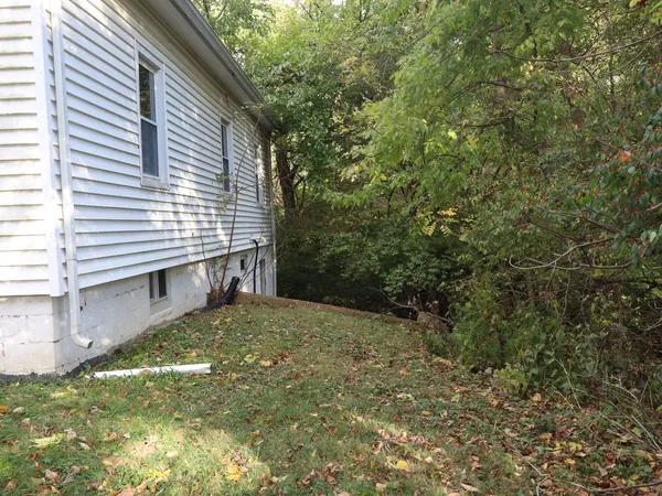 a backyard of a house with lots of green space
