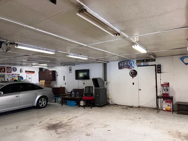 a view of parking garage with cars