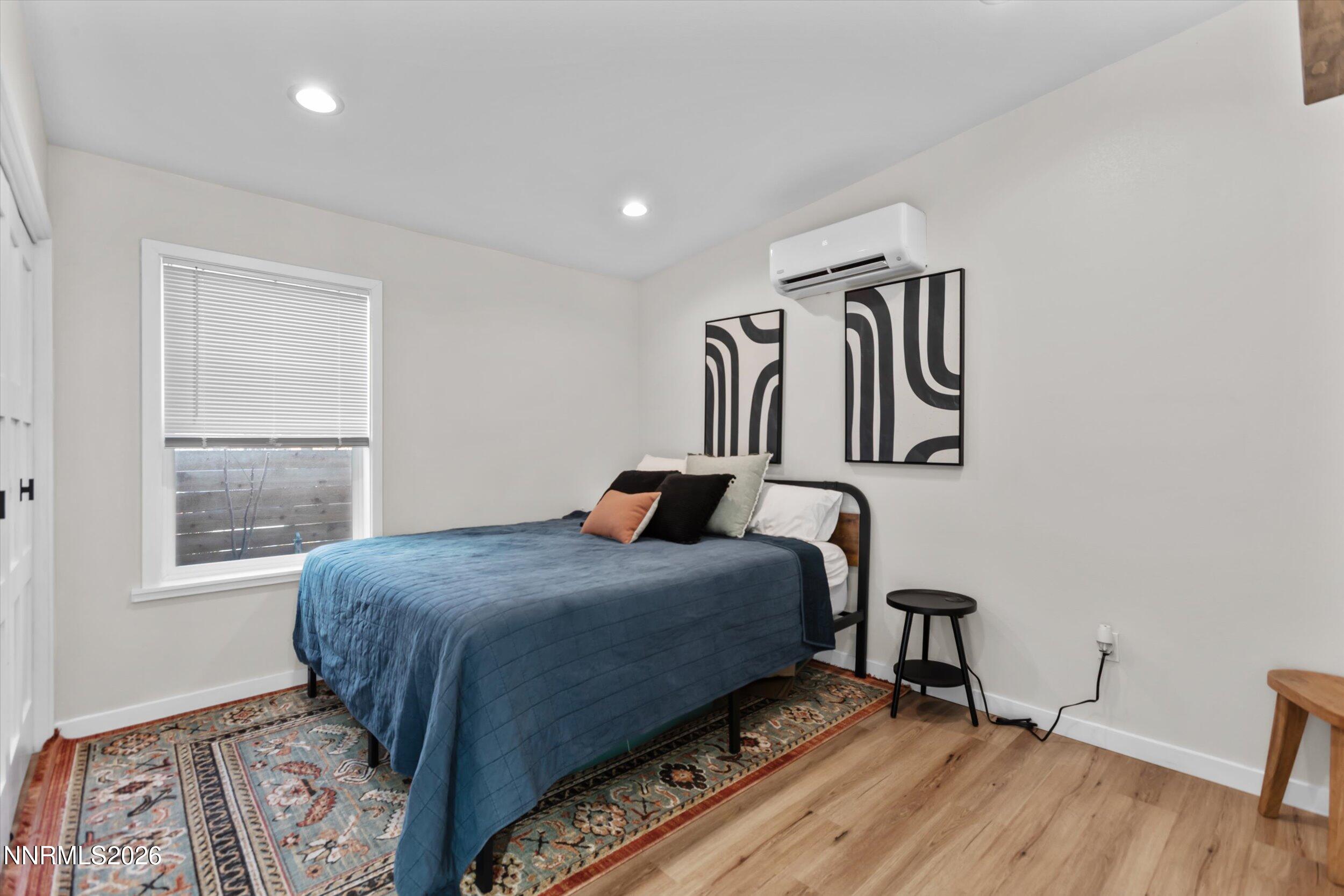 536 Sinclair Street Reno, NV 89501 - Photo 12 of 24 a bedroom with a bed and a window