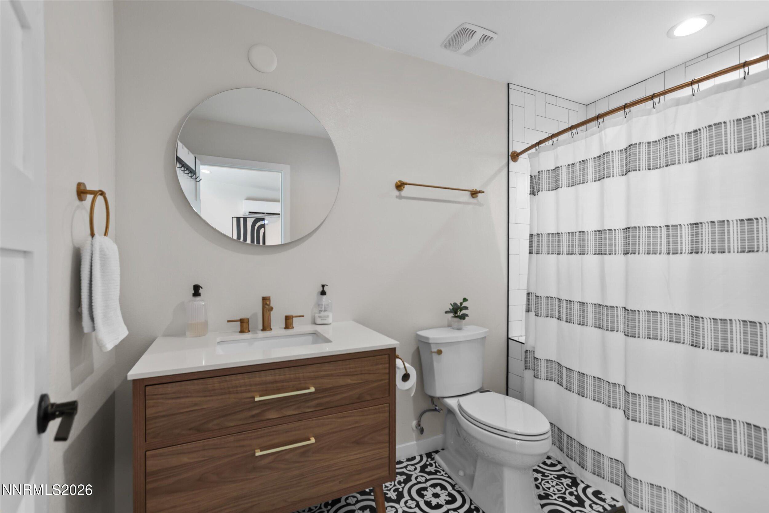 536 Sinclair Street Reno, NV 89501 - Photo 14 of 24 a bathroom with a sink toilet and shower