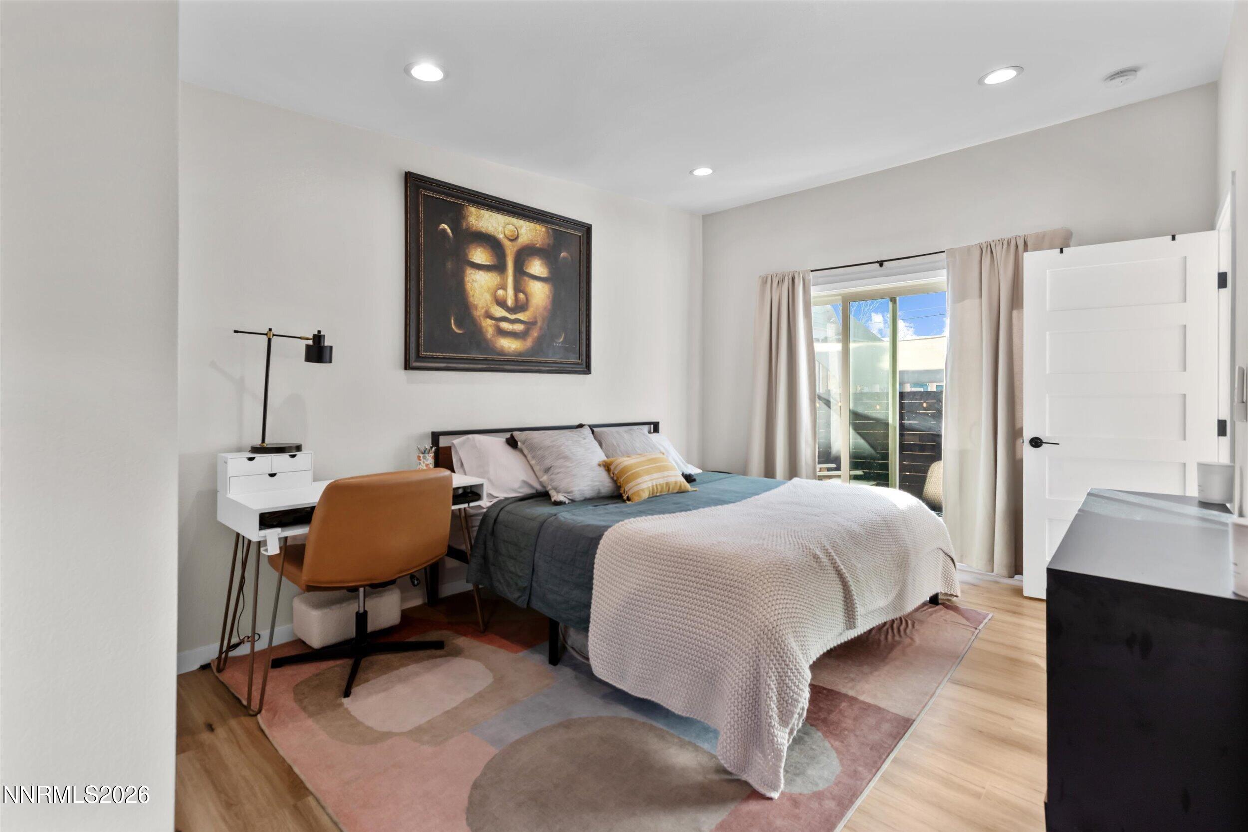 536 Sinclair Street Reno, NV 89501 - Photo 9 of 24 a bedroom with a bed a desk and chair