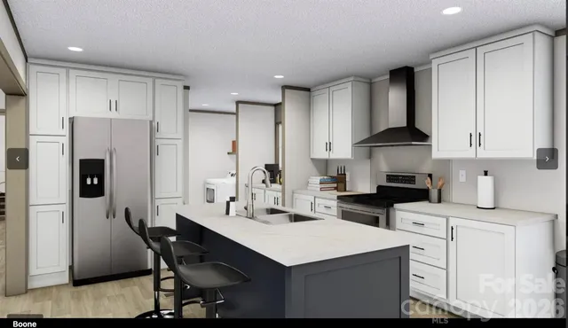 a kitchen with a white cabinets and refrigerator