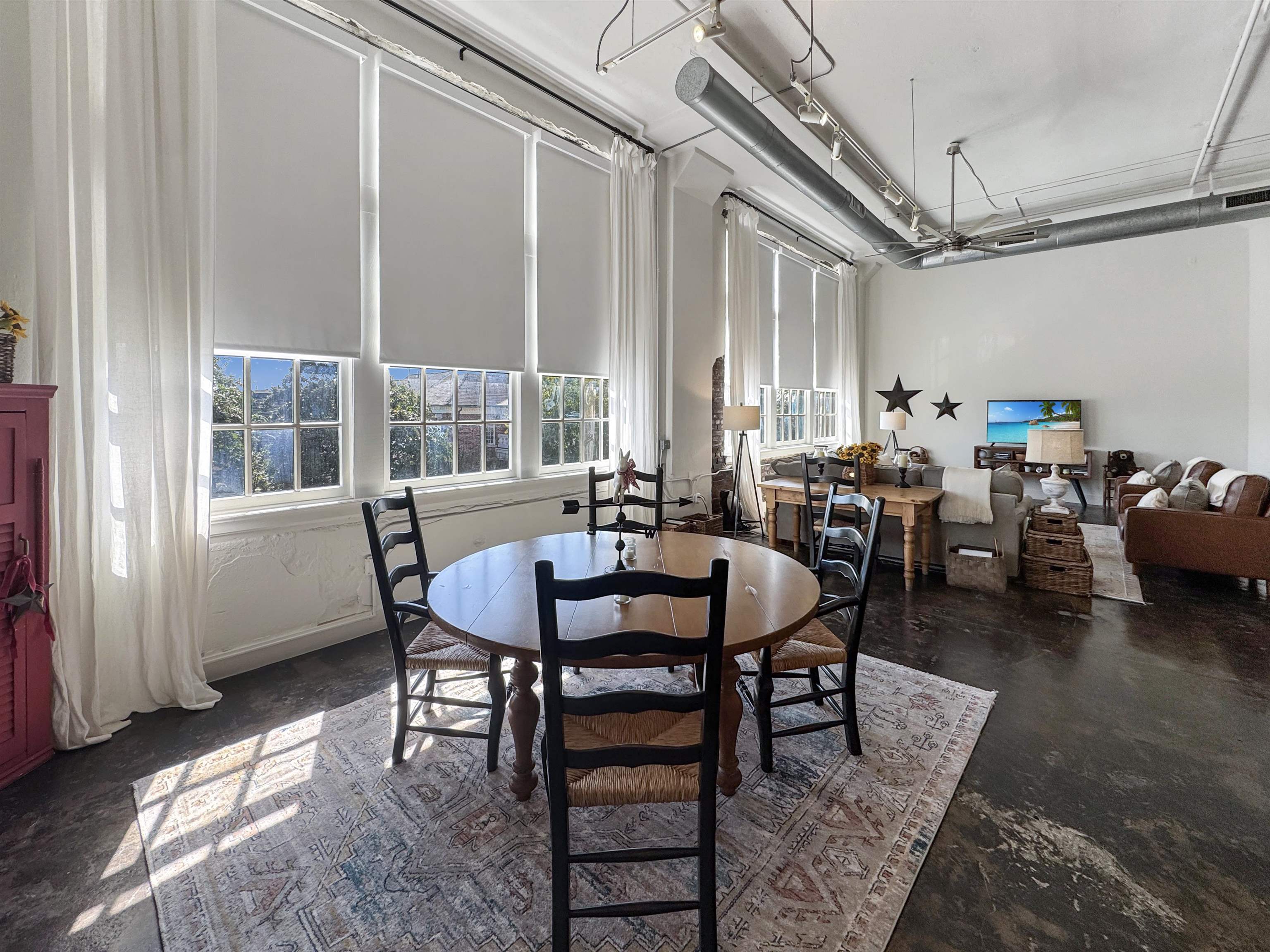 505 Tennessee Street, Unit 213 Memphis, TN 38103 - Photo 12 of 33 a view of a dining room with furniture and a window