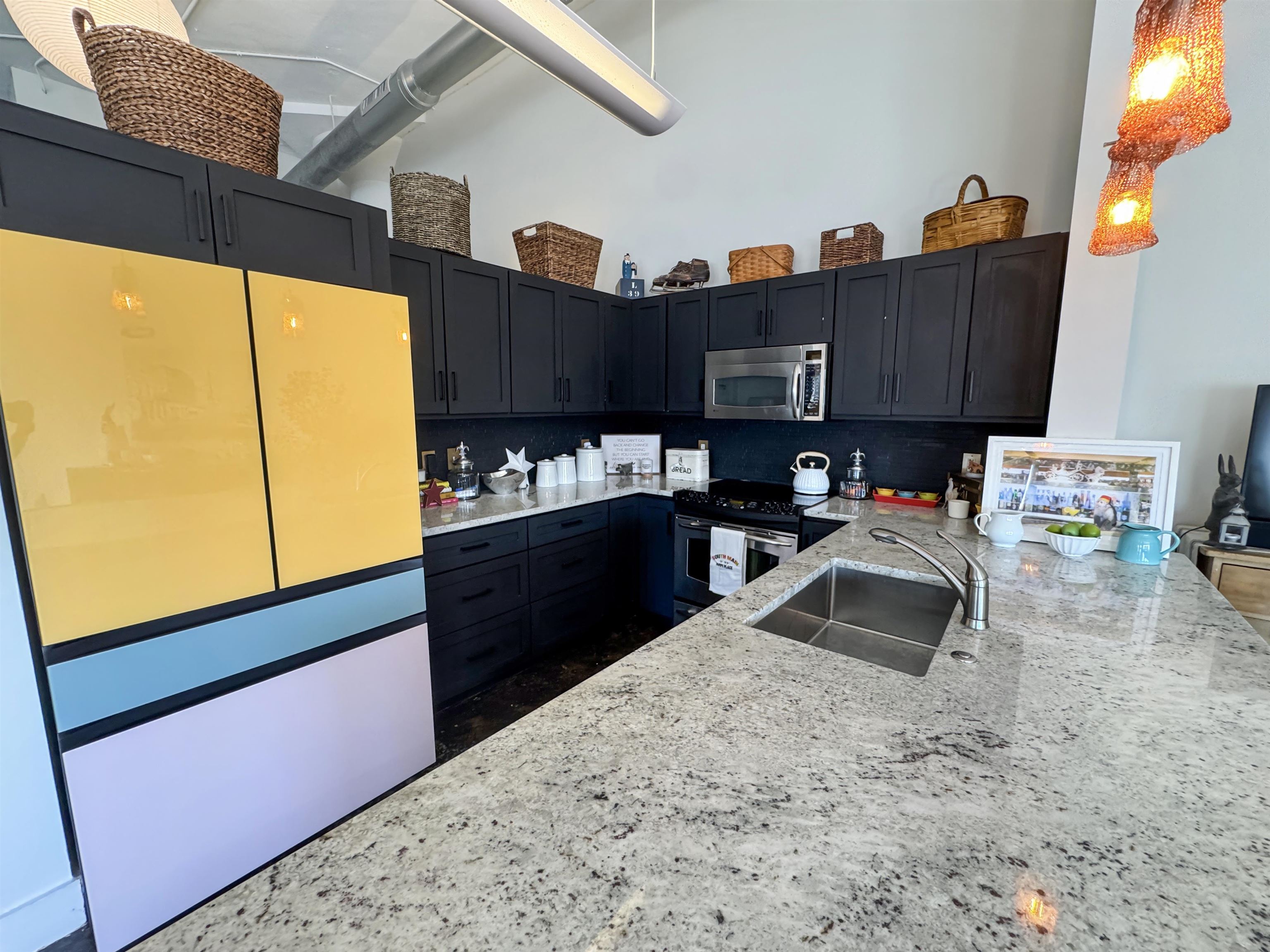 505 Tennessee Street, Unit 213 Memphis, TN 38103 - Photo 13 of 33 a kitchen with granite countertop sink cabinets and appliances