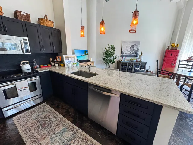 a bathroom with a toilet and shower curtain