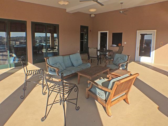 505 Tennessee Street, Unit 213 Memphis, TN 38103 - Photo 30 of 33 a living room with patio furniture and a floor to ceiling window