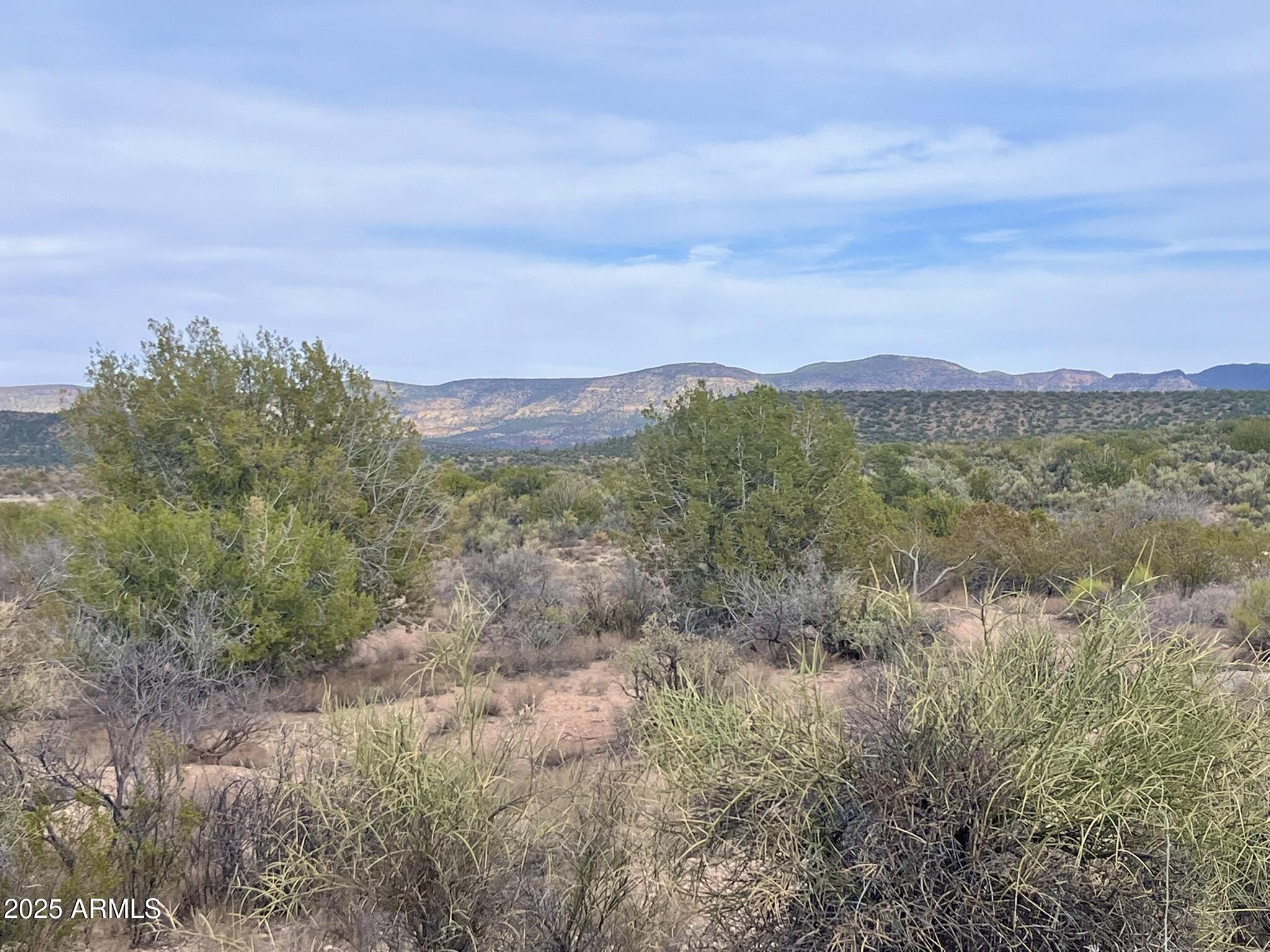 3075 Sonora Pass, Unit 65 Rimrock, AZ 86335 - Photo 13 of 17 a view of a town with mountains in the background